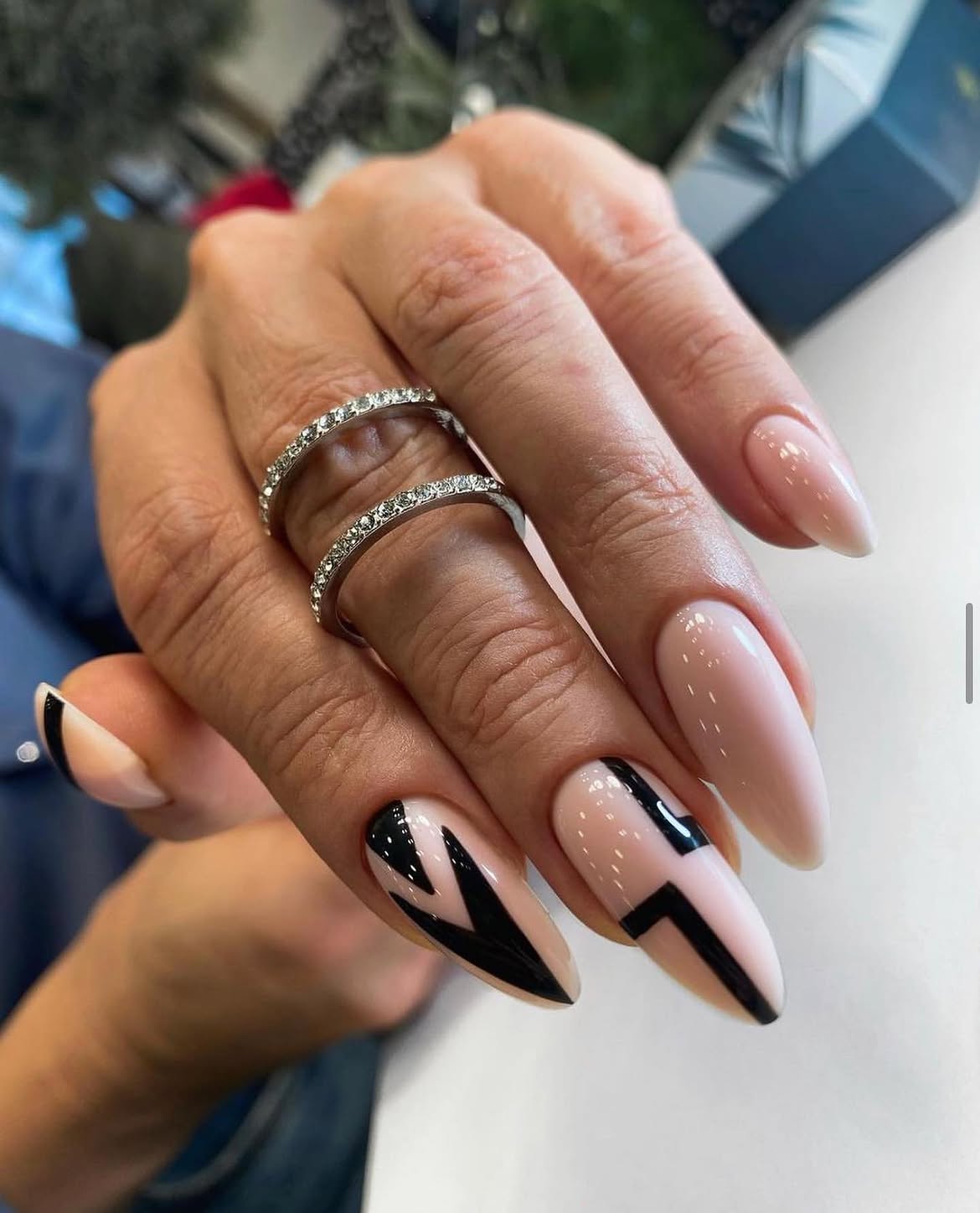 Chic Nude Almond Nails with Black Abstract Art