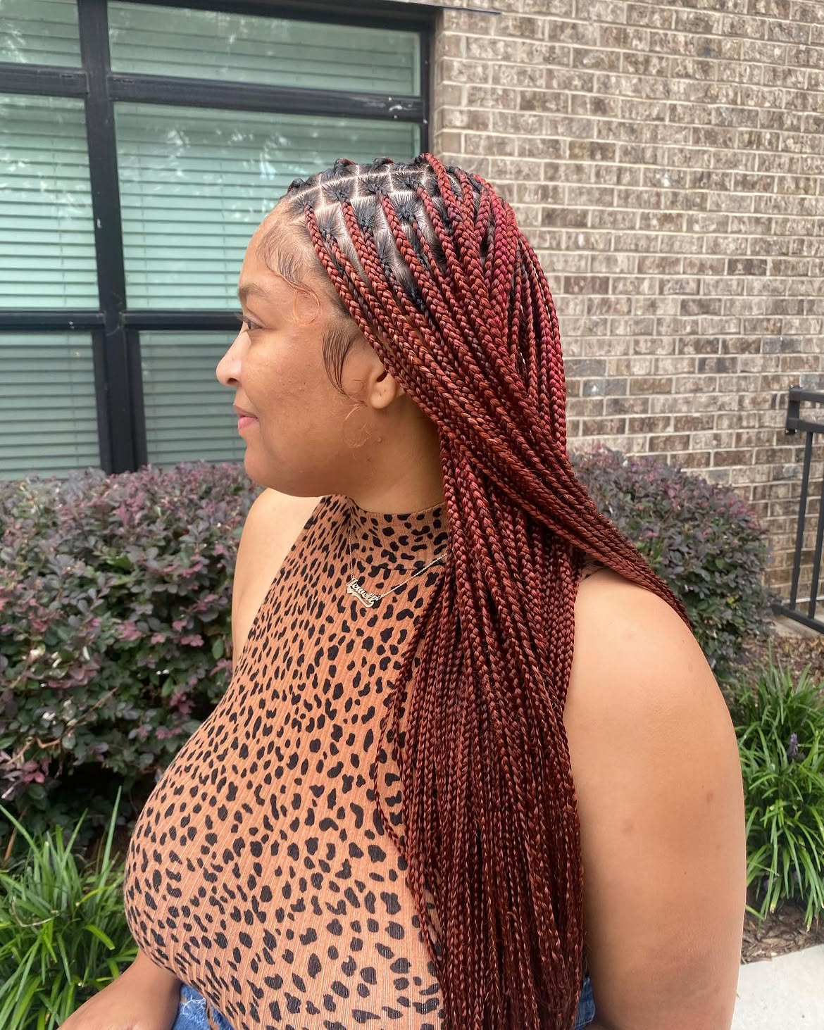 Chic Red Box Braids With Defined Parts