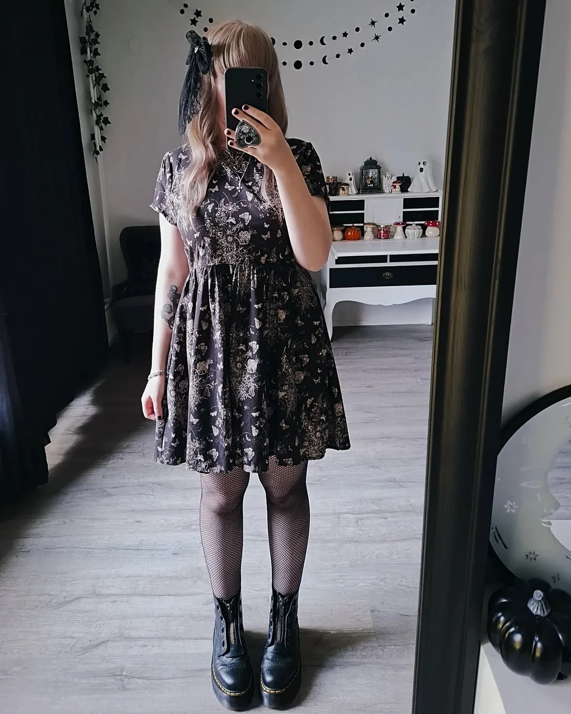 Dark Floral Fit-and-Flare With Fishnets and Boots