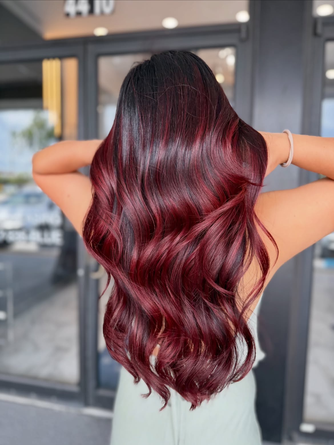 Deep Cherry Cola Balayage With Loose Waves