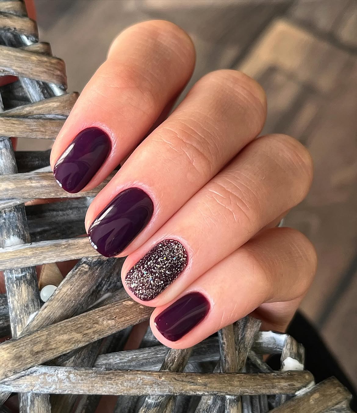 Deep Plum Glossy Nails with Glitter Accent