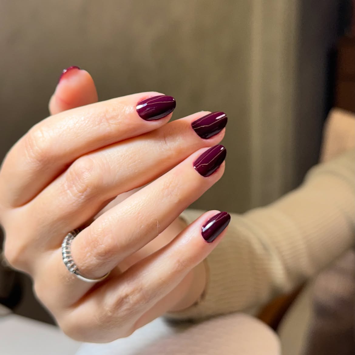 Deep Plum Glossy Oval Nails with Gold Lines