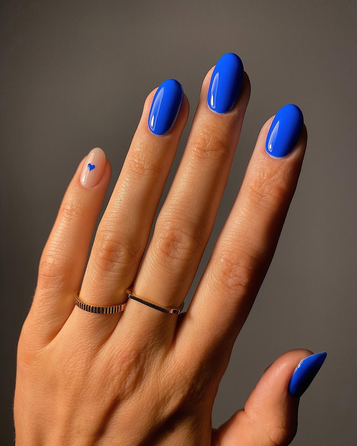 Electric Blue Oval Nails with Tiny Heart Accent