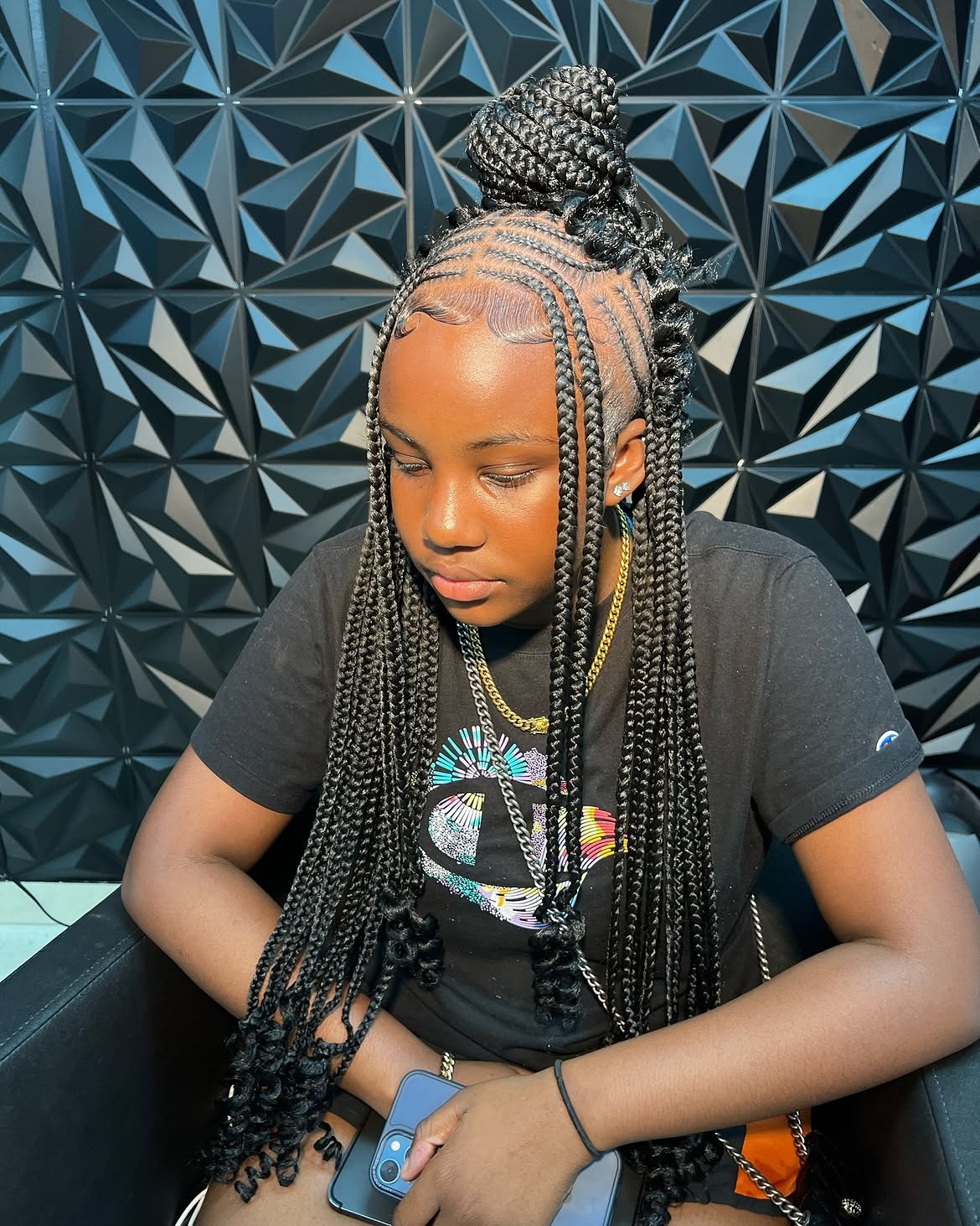 Elegant Fulani Braids With A Top Knot Bun