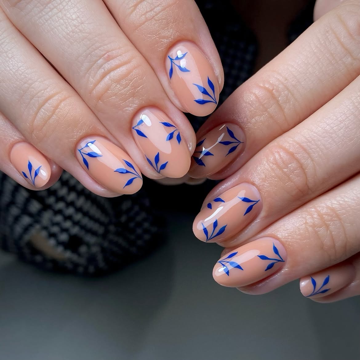 Elegant Nude Oval Nails with Blue Leaf Accents