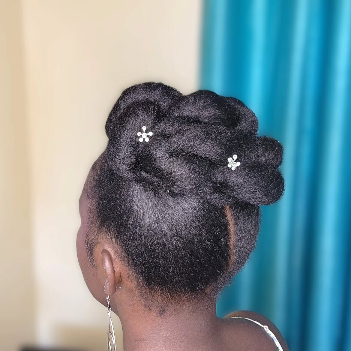 Elegant Sculpted Updo With Floral Pins