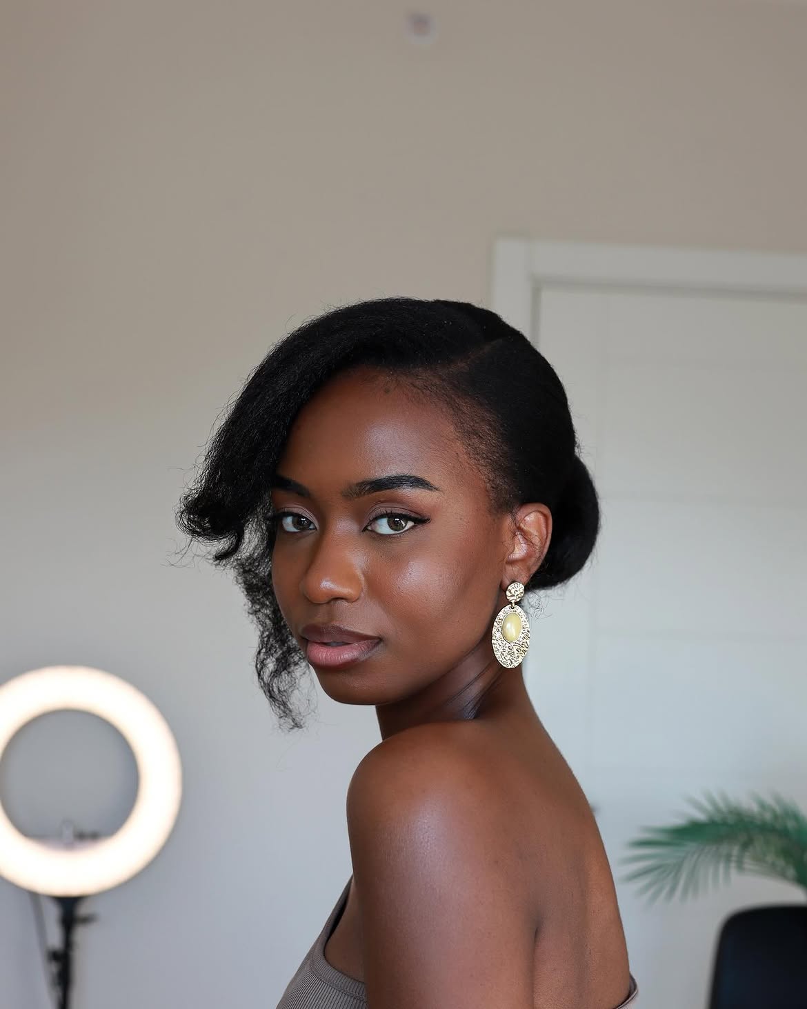 Elegant Side-Swept Updo With Defined Coils
