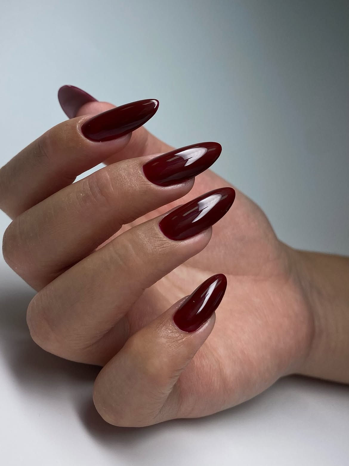Glossy Deep Burgundy Almond Nails