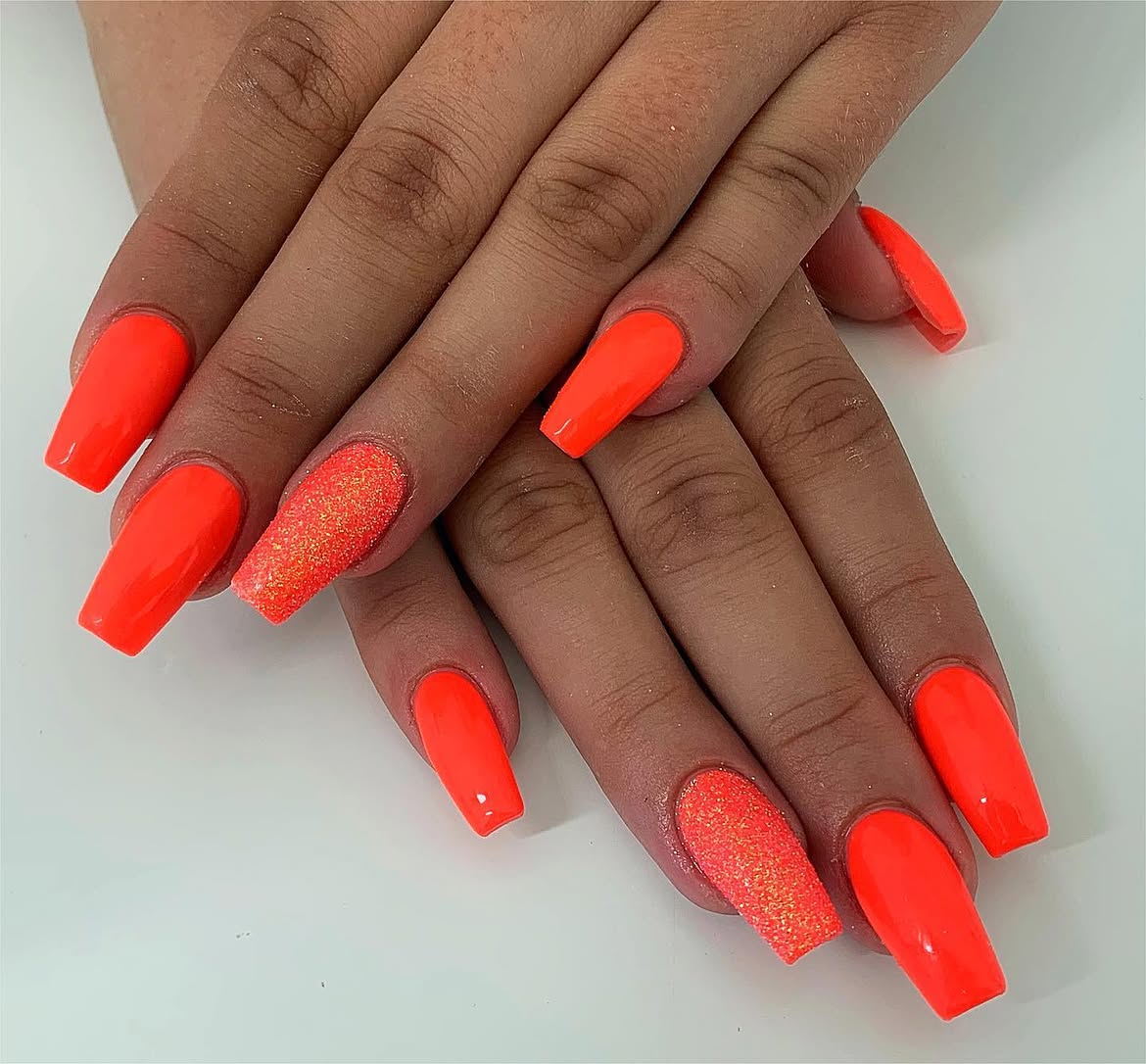 Neon Orange Coffin Nails with Glitter Accent