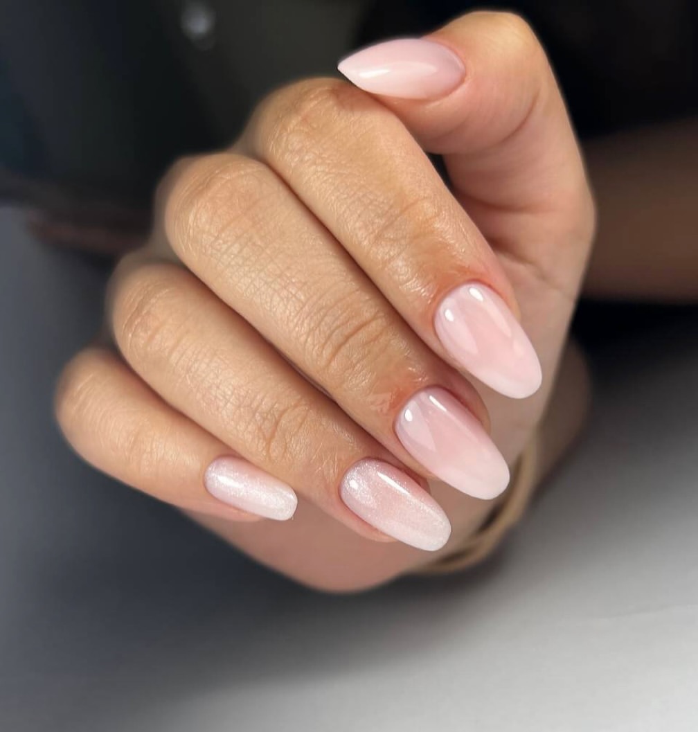 Pale Pink Milky Almond Nails with Subtle Shimmer