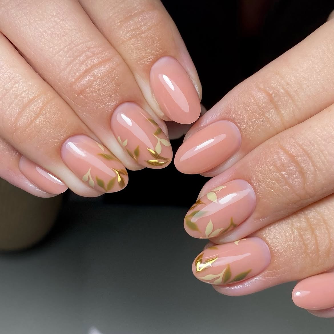 Peachy Nude Oval Nails with Gold Leaf Accents