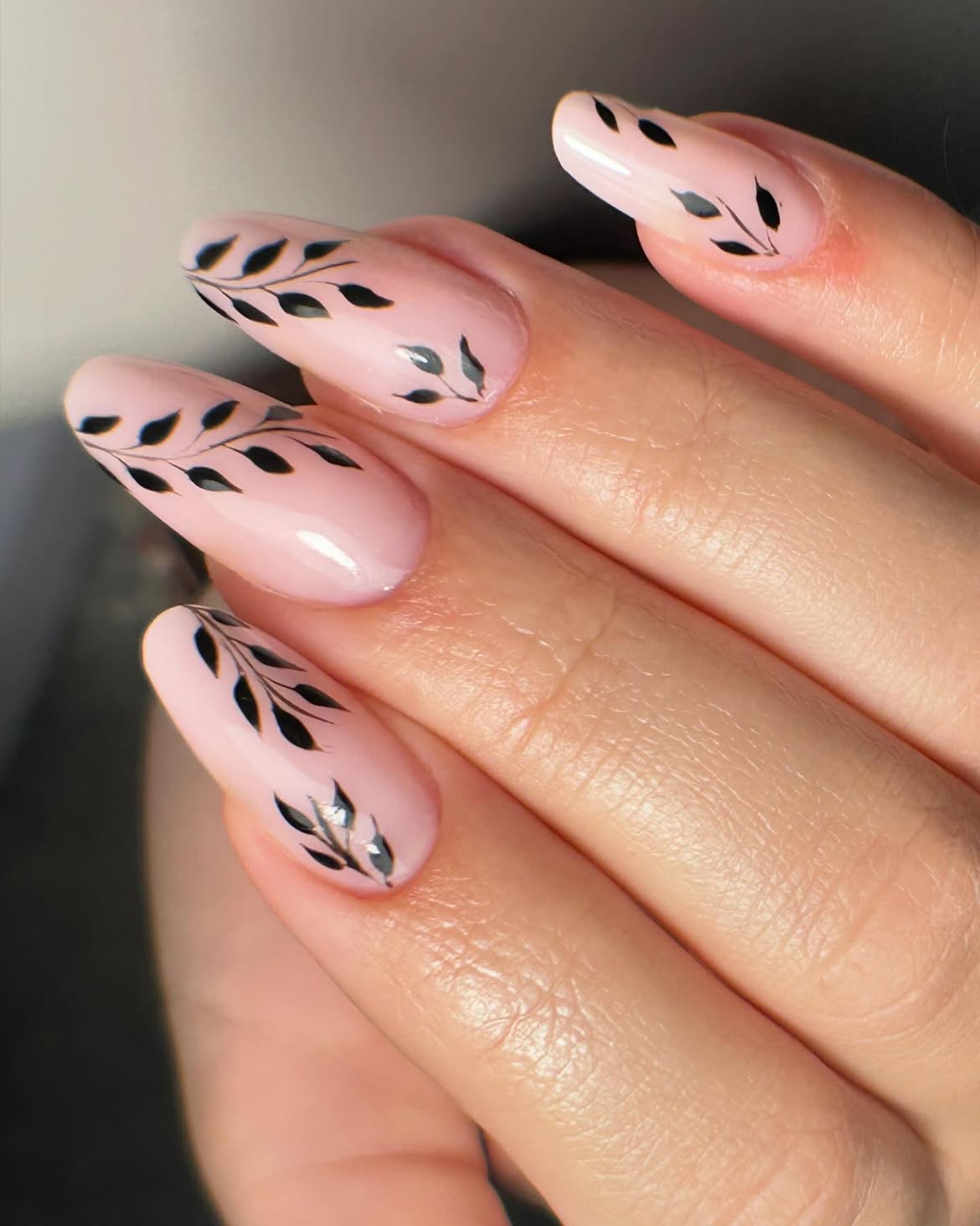 Pink Oval Nails with Delicate Black Leaf Art