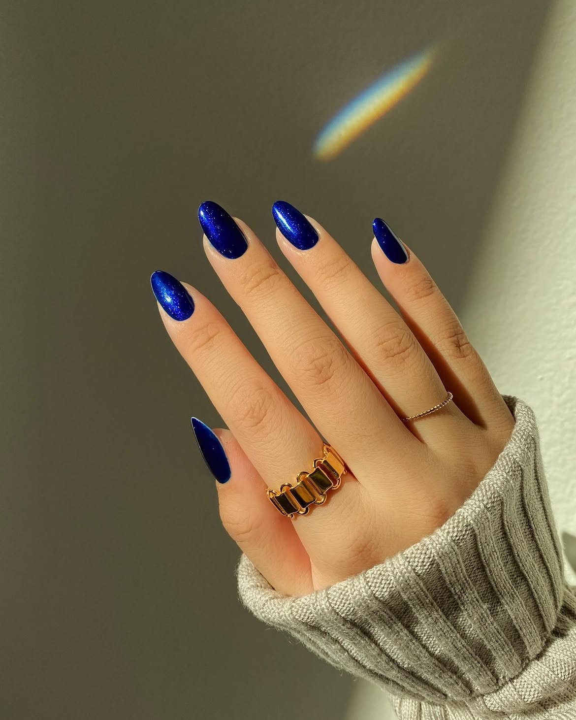 Sparkling Deep Blue Almond Nails