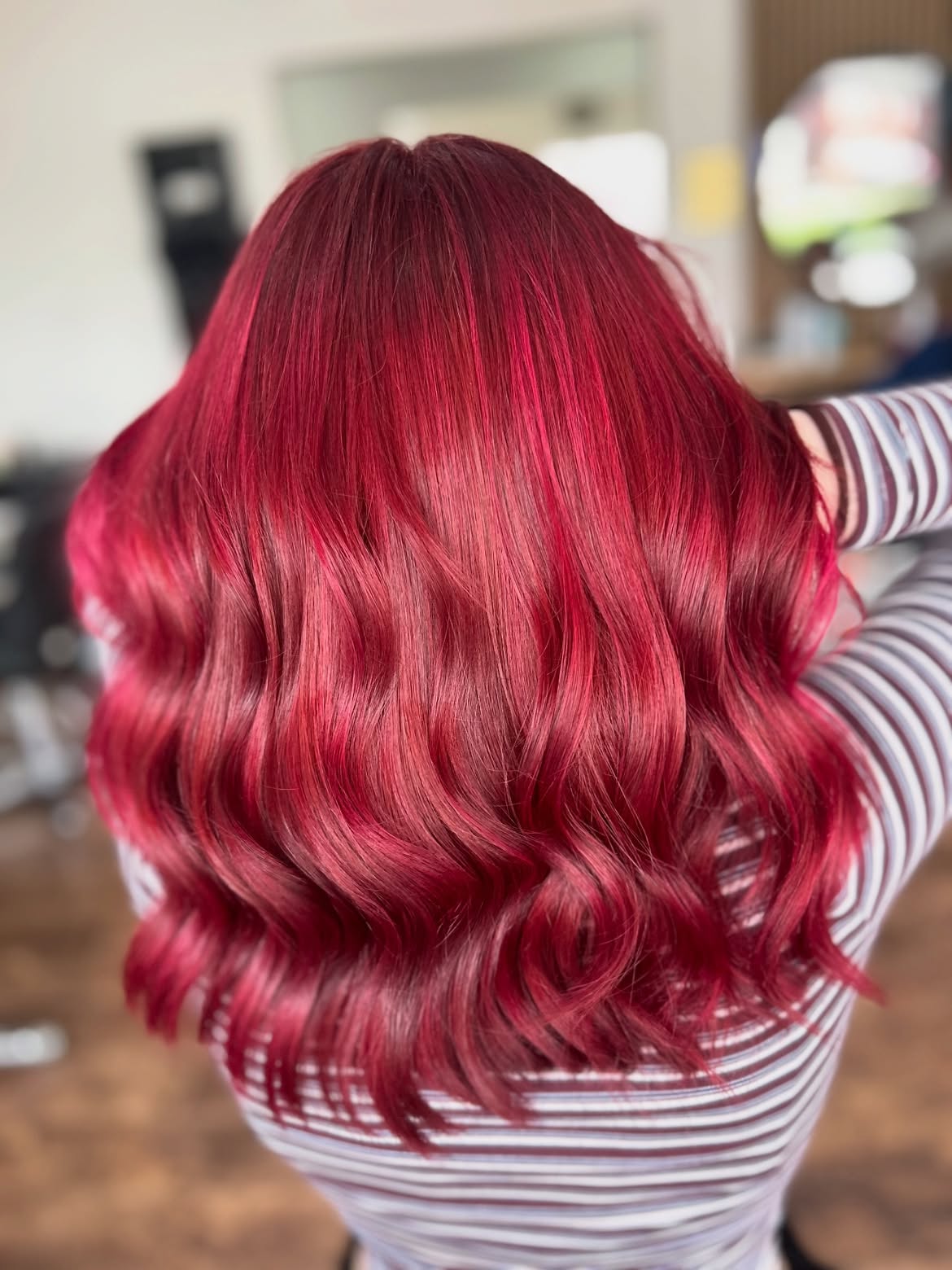 Vibrant Cherry Red Curls With Subtle Pink Highlights