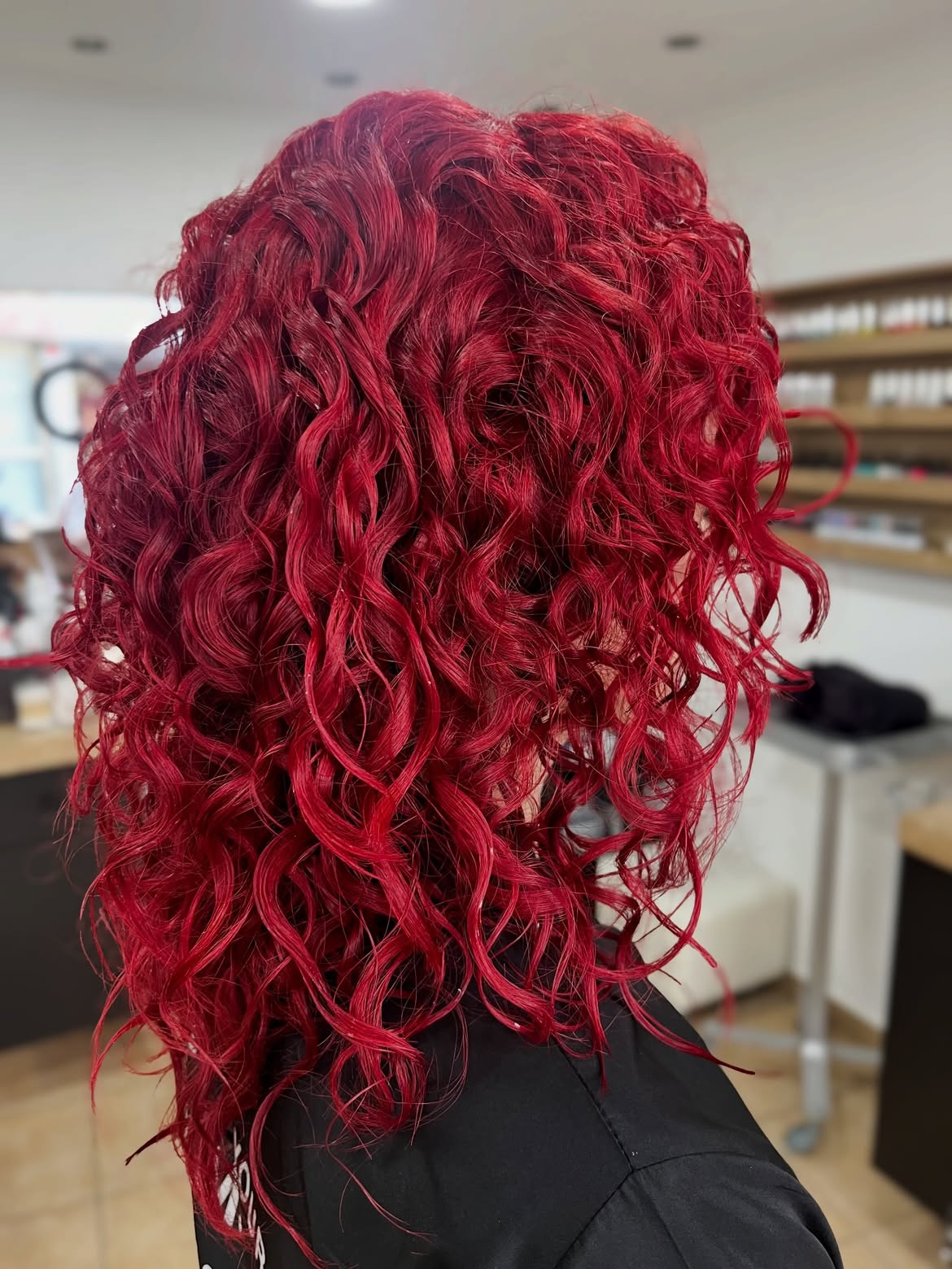 Vibrant Cherry Red Curly Shoulder-Length Bob
