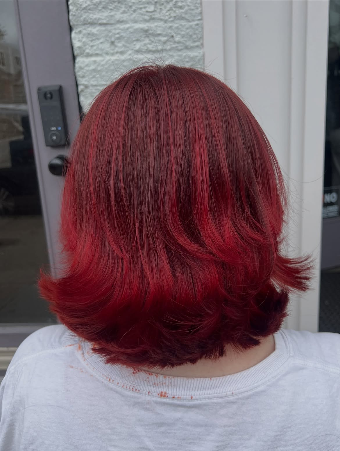 Vibrant Cherry Red Layered Bob With Subtle Ombre