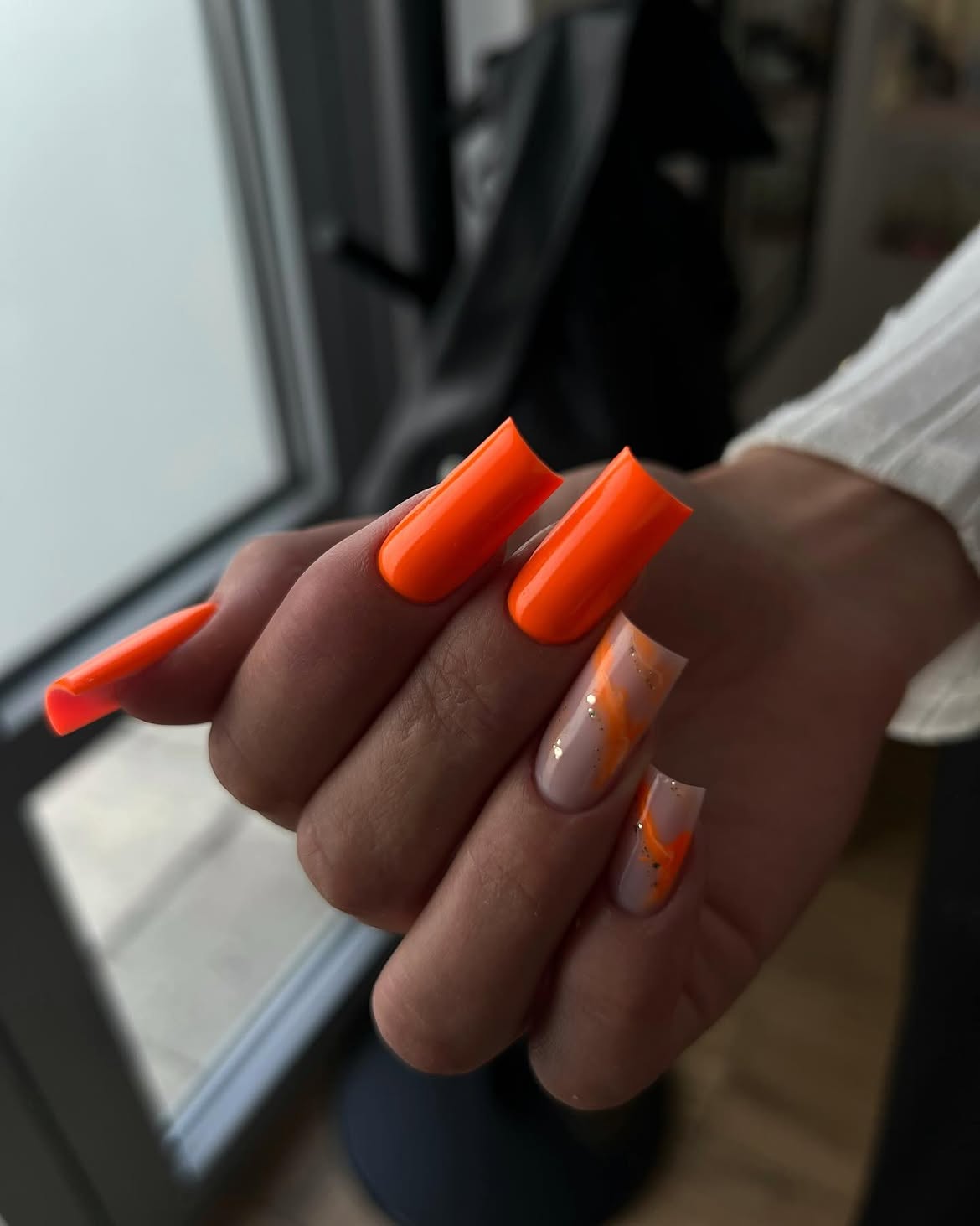 Vibrant Neon Orange Swirl Chrome Accent Nails