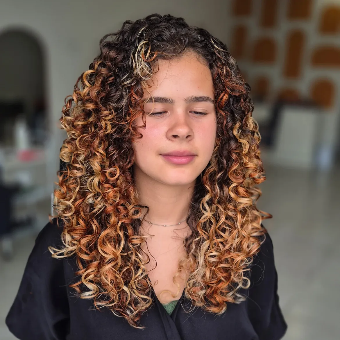 Warm Bronde Balayage On Voluminous Curls